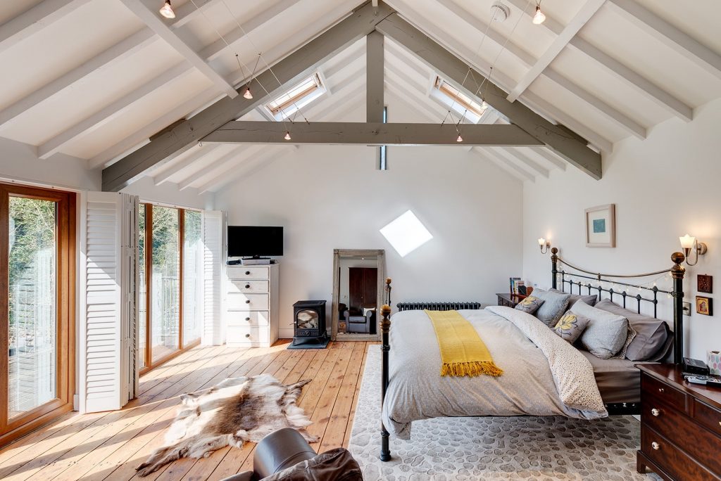 Barn conversion double height bedroom