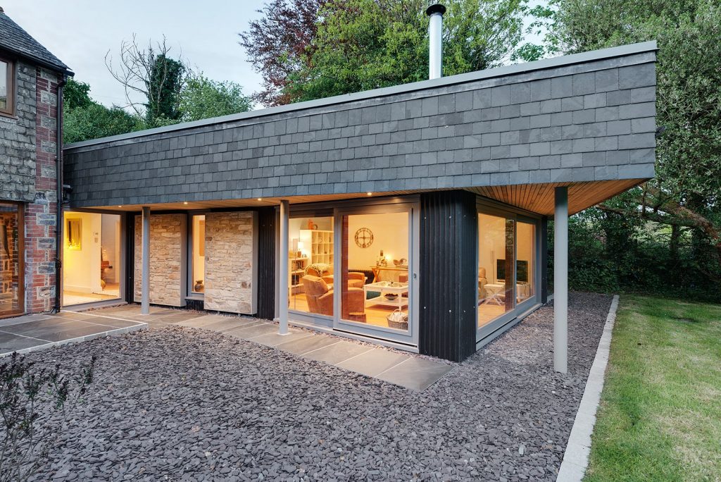 Contemporary extension with slate cladding and stone